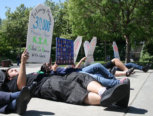 Protestors from the Brady Campaign lie down at the DVC main Quad for the one year anniversary of the Virginia Tech massacre. ()