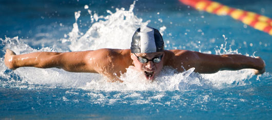 Joe Natina swims to the finish line at the CCCAA state championshipat Saddleback College in Mission Viejo. (Scott Pearson)