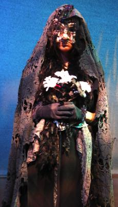 Clothed in decaying garments and flowers, Frankenstein's mother rises from the dead. (Ed Trujillo)