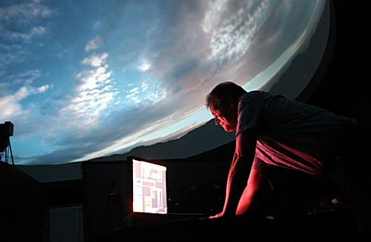 Astronomy instructor Paul Sasse projects a time-lapse video of a Utah scene  going from sunrise to sunset in DVCs new state-of-the-art planetarium. ()