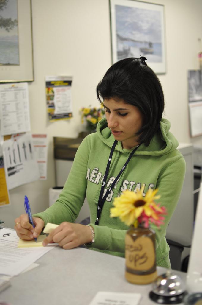 Rashimi Luthra, a secretary at the Student Union office, deals with incoming paperwork and helps with inquiries from students. (Photo by Travis Jenkins/The Inquirer 2010)