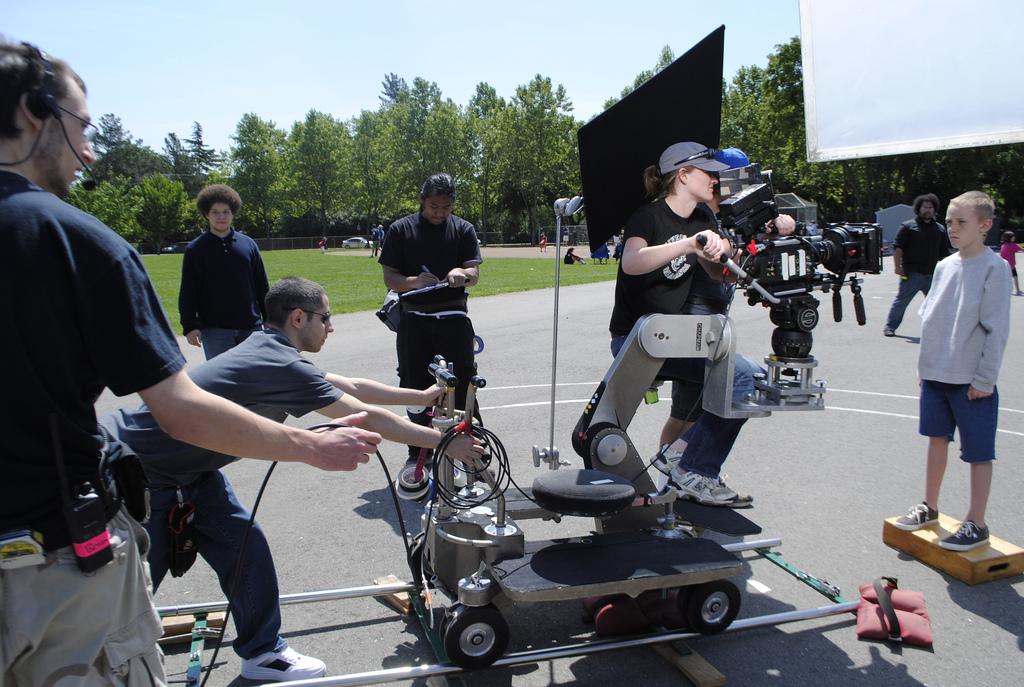Camera operator Jessica Fisher pushes in for a dolly shot on May 8 on the set of Marbles. (Photo by Courtney Johnson/The Inquirer 2010)