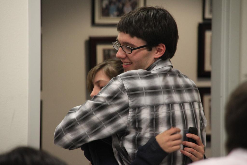 Brian Donovan, vice president of legislative affairs-elect, hugs student Roxy Cappelini after all charges were dropped at the May 4 Election Committee meeting. (Photo by Courtney Johnson/The Inquirer 2010)