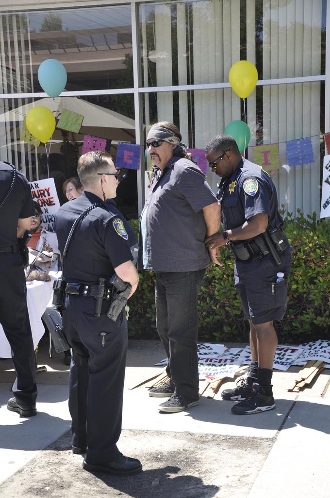 Student Frank Runninghorse is handcuffed at the Latino Student Alliances Cinco de Mayo Festival after ASDVC Activities Coordinator Adrian Briones files a citizens arrest form for battery. (Photo by Travis Jenkins/The Inquirer 2010)