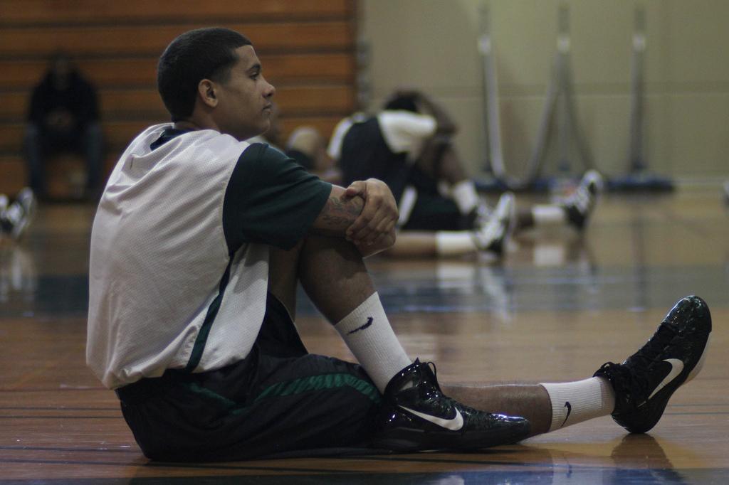 Khufu Najee stretches out with his teammates before starting their practice on Thursday, Nov. 23.  (Kevin Hayes/The Inquirer)