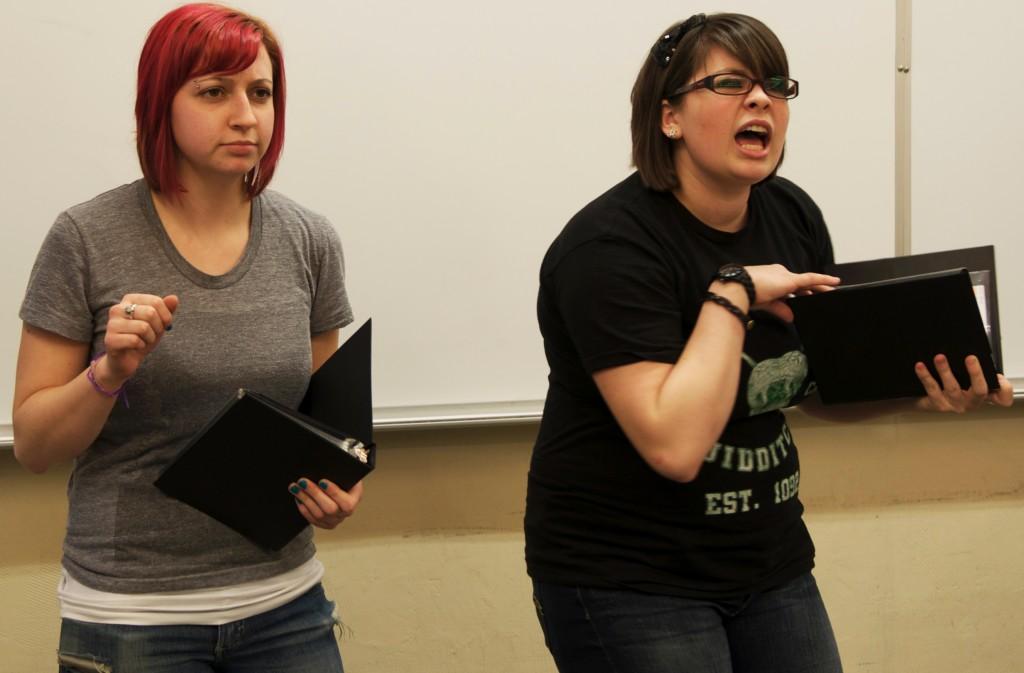 Lelah Smick, left, and Natalie Meany practice an interpretation speech for their third leg win. (Izzy Bajalia / The Inquirer)