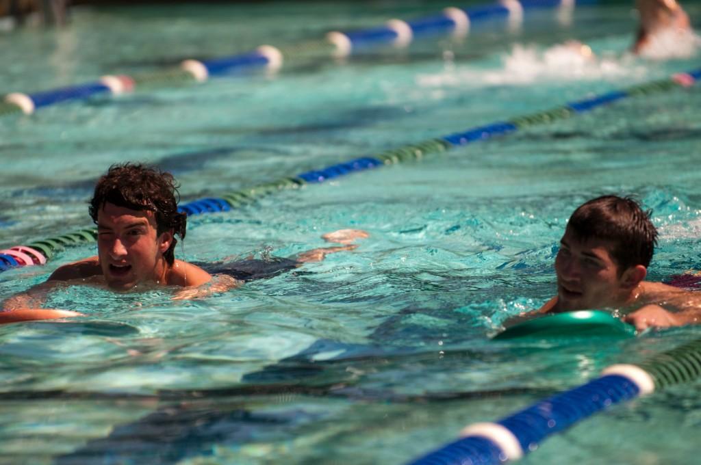 Jake Patterson, left, and Sam Barton swim laps at the DVC pool during the triathlon training class on March 28, 2011. (Stevie Chow/The Inquirer)