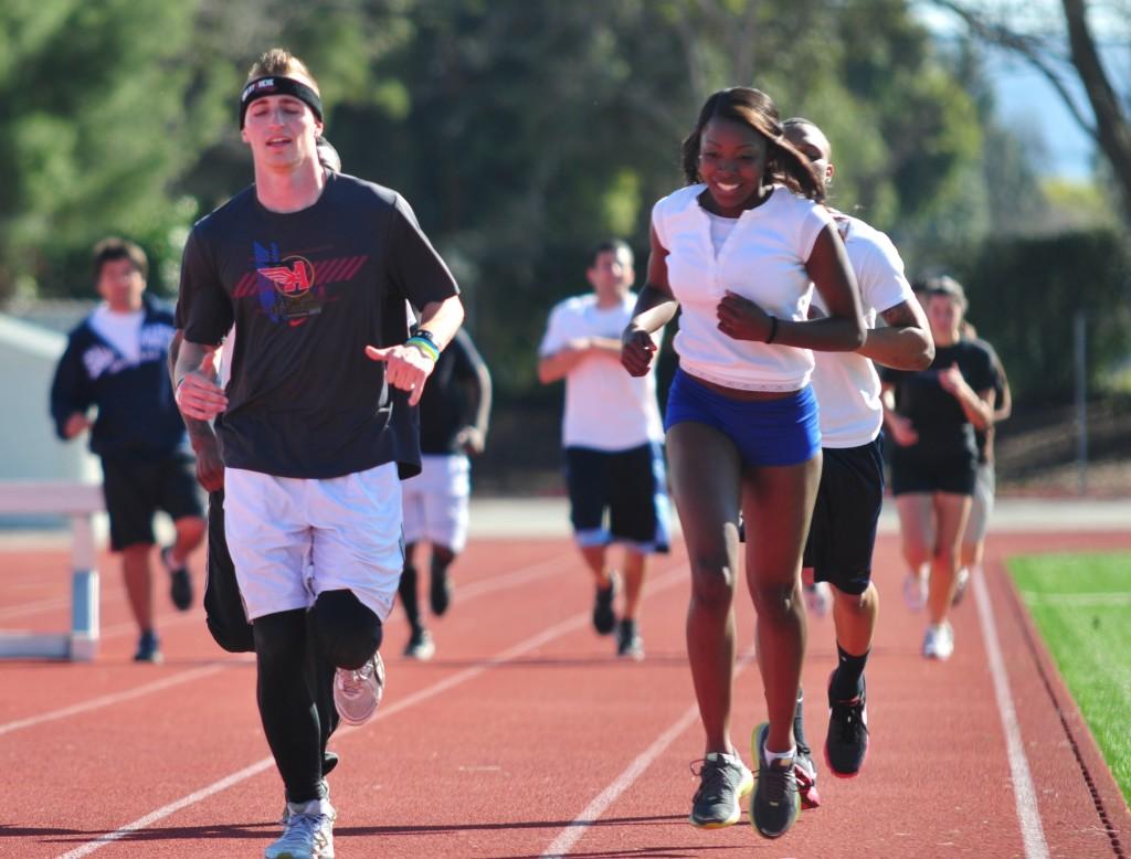 Chazz Griffiths leads Vikings runners during a warm up run at the beginning of practice on March 1, 2011 ()