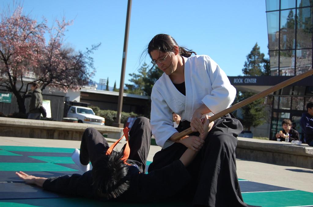 Sensei Steven Rodriguez working with club member Mike Nguyen during the Aikido-jiujitsu demonstartion. (Mariana Ramos/The Inquirer)