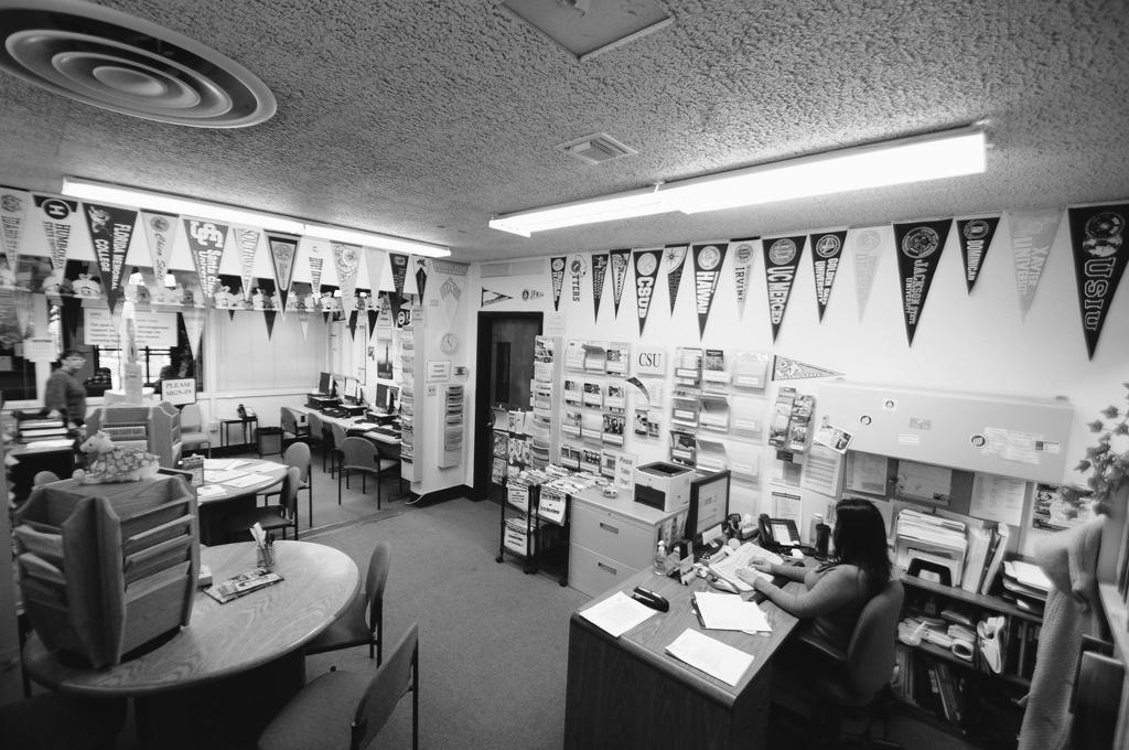 Bianca Estrella, interim transfer center coordinator, works at ther desk in the soon to be closed center. (Alec Graham)