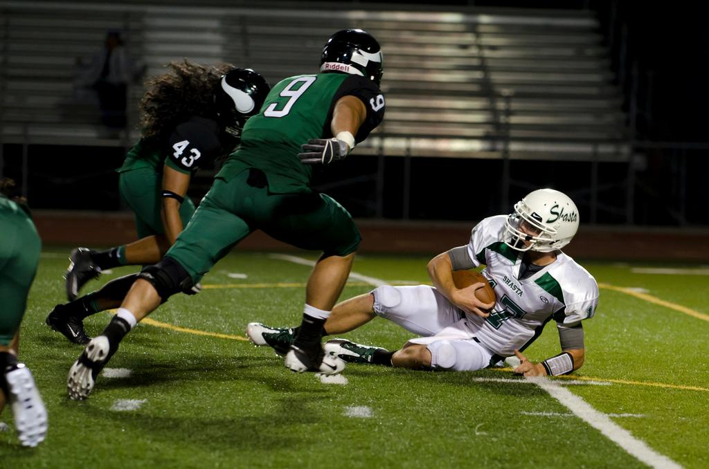 Linebackers Ryan Gomez, front, and Siuea Vaesau pursue Shastas fallen quarterback at the Sept. 9 game.. (Stevie Chow / The Inquirer)