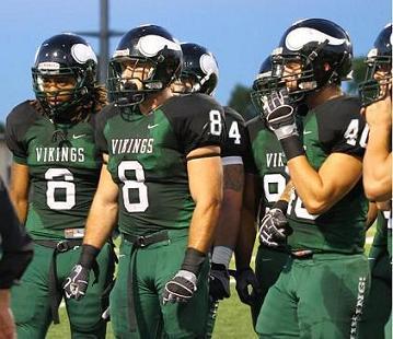 Morgan Breslin, No. 8, stands and listens to coaches with teammates during a game. (Courtesy of DVC Athletics)