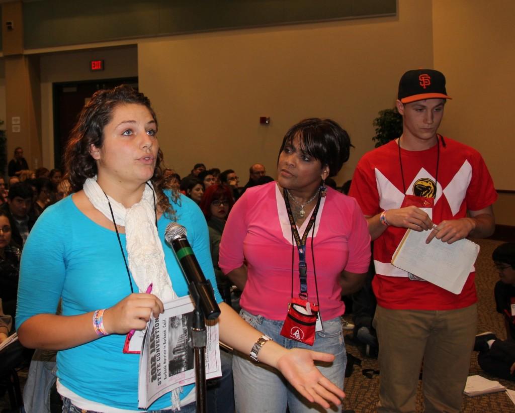 Opinions editor Lisa Diaz, left, and staff writer Tom Rizza, far right, ask questions druing the keynote address. Diaz won second place in the on the spot opinion writing contest. (Alex Brendel / The Inquirer)