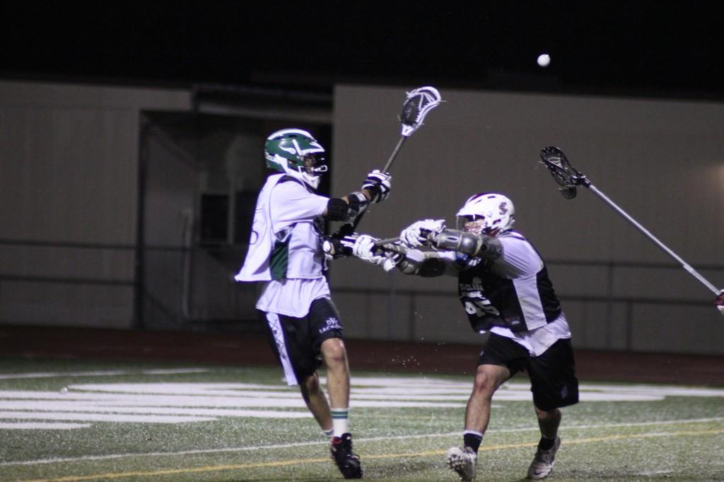 Cory Callahan gets off a pass while being hit in the chest by a Santa Clara defender. (Mike Alfieri / DVC Inquirer)