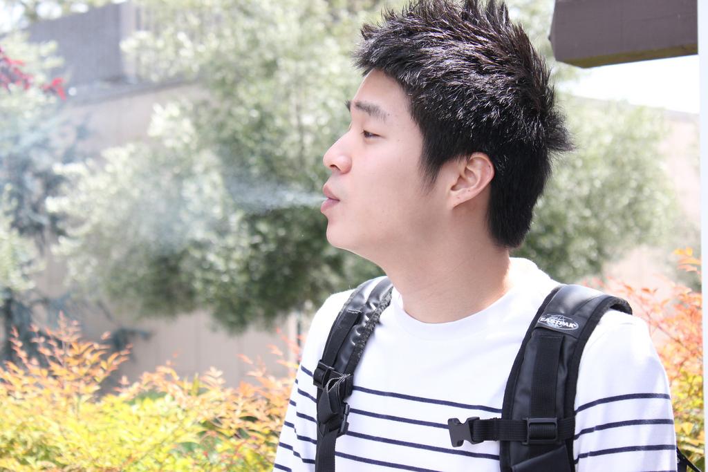  DVC student exhales in designated smoking area. Karin Jensen/The Inquirer