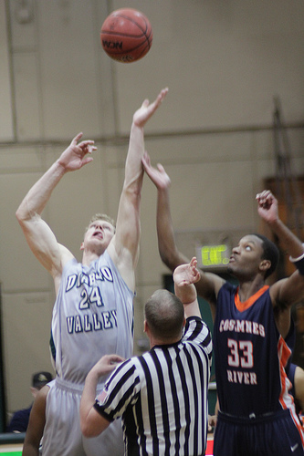 Mike Harris wins the opening tip away from the Hawks