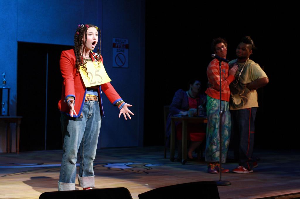 Logainne Schwartzandgrubenniere, played by Micaela Groman, sings about her stressful life with two overly-competitive fathers in The 25th Annual Putnam County Spelling Bee.