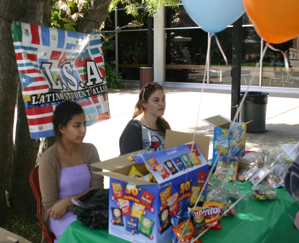 Representatives of the Latino Student Alliance promote their celebration of Cesar Chavez Day (Pablo Caballero / The Inquirer)