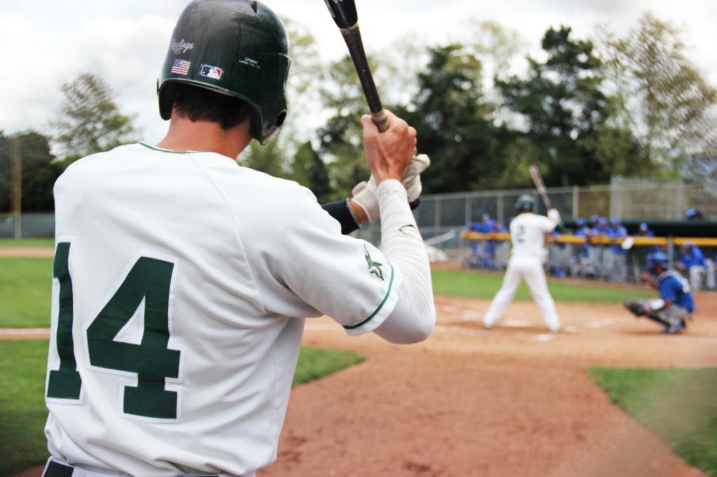 Outfielder Davis Strong (left) warms up while outfielder Athan Koutsoubinas bats in DVC's game against Modesto last Friday.
(Karin Jensen / The Inquirer)