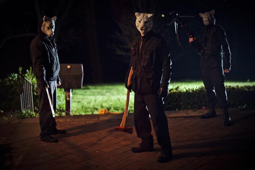 Masked killers invade the lives of a reunited family in horror film, Youre Next, directed by Adam Wingard and opening August 23, 2013.

// Lionsgate Films.