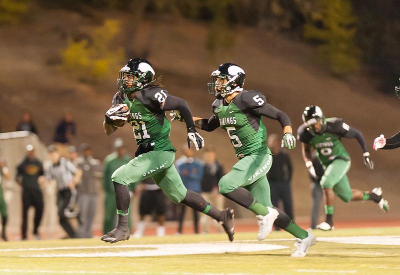 DVC DB Naim McGee (No. 21) gets an interception in the second quarter against College of San Mateo to score the Vikings first TD of the game. Pleasant Hill, CA. Sept. 20, 2013. (Andrew Barber/ The Inquirer).