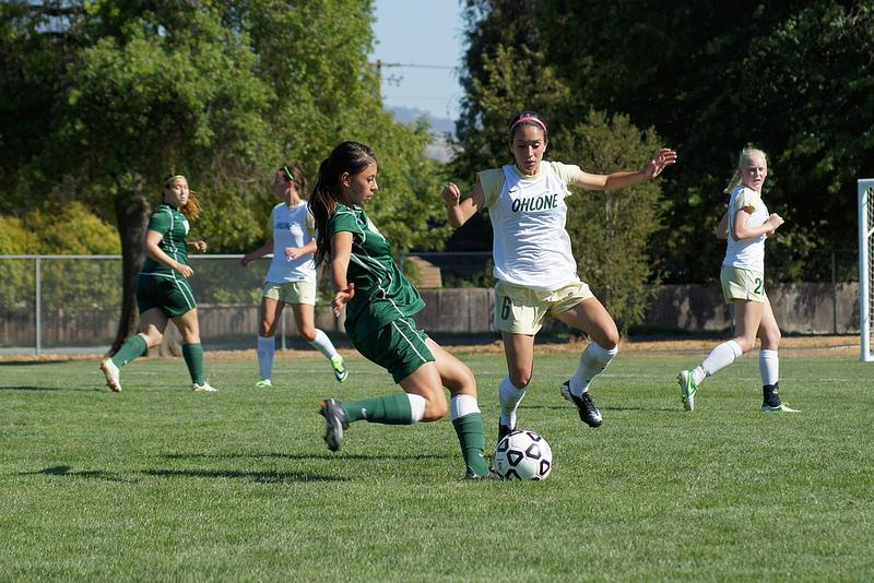 Midfielder Delia Jimenez aims a pass upfield to her forwards in Fridays game against Ohlone.

The game ended in a tie, with a final score of 2-2 on Sept. 6.