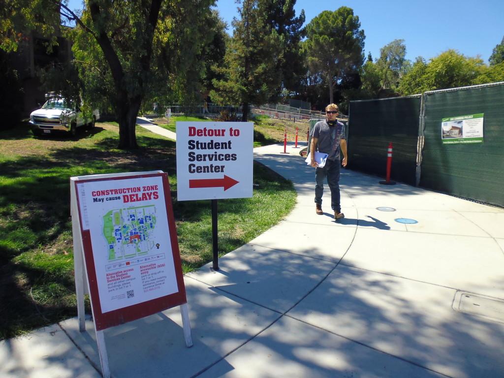 DVC student Mathias Armstrong uses the detour due to the front entrance construction on August 28, 2013. Many students are frustrated with the recent changes. (Julian Mark / The Inquirer)