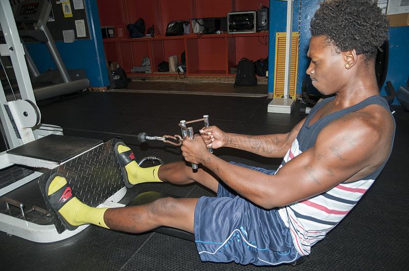 Briscoe Allen, 21, performs rows in the weight training class, which experienced lower enrollment due to limited repeatability and the name change. (Gustavo Vasquez/ The Inquirer)