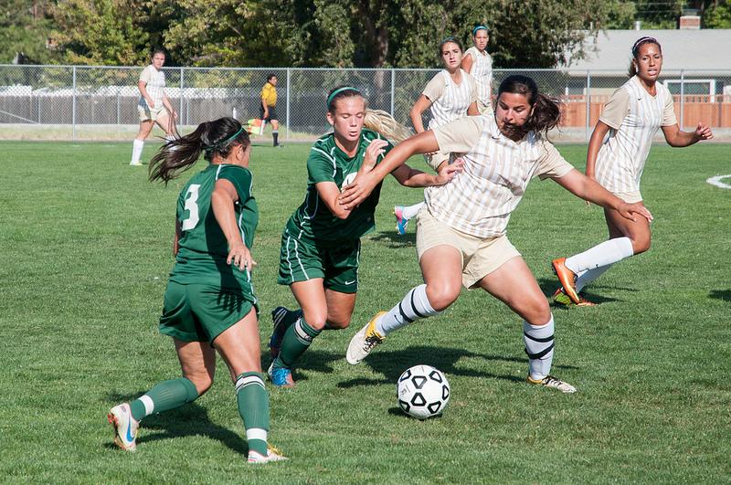 Midfielder Pamela Ramos (8) and  defender Haley Paxton (12) intercept the ball from Delta at the DVC soccer field on Tuesday, Oct. 1, 2013 (Gustavo Vasquez/ The Inquirer)