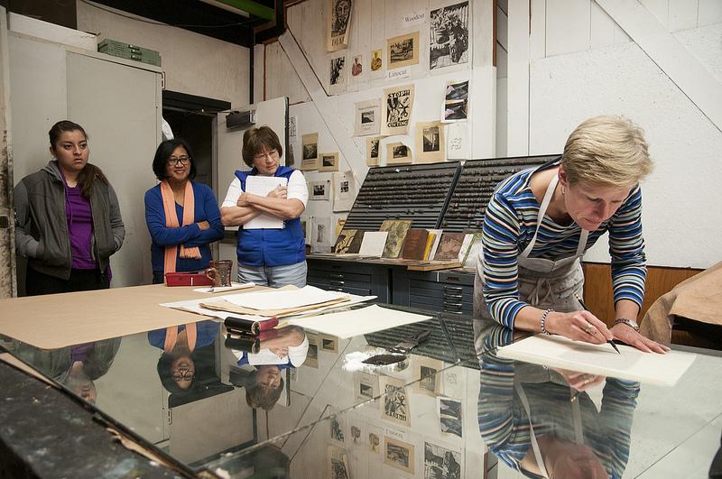 Sarah Smelser demonstrating print making to DVC students.Photo credit: Gustavo Vasquez