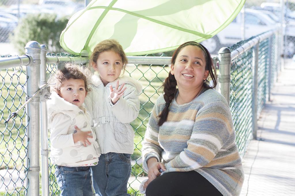 Student Michelle Barahona picks up her two daughters, Keyla and Kianna after school on Jan. 30, 2014. Barahona is one of many student parents who benefit from the early childhood education program.