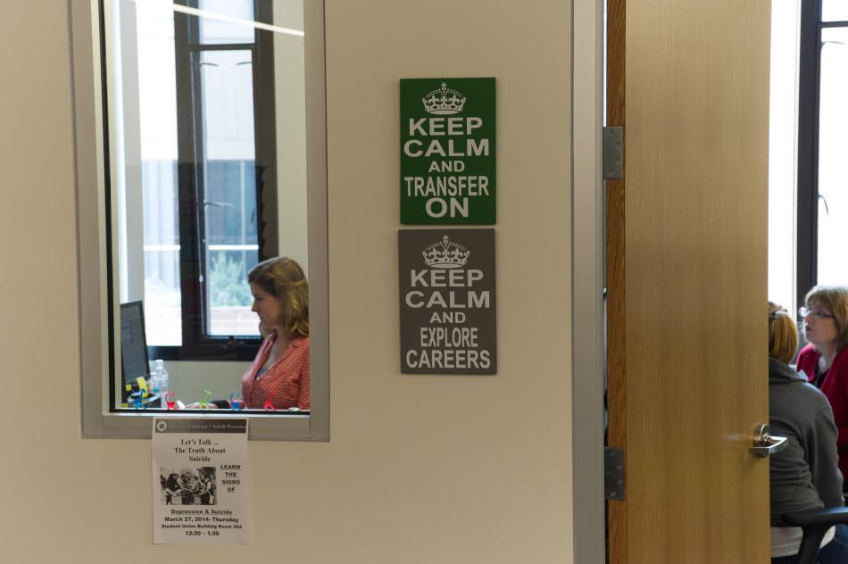 Sarah Boland (left)  career and employment services coordinator, sits in her office and Annie Chandler (right) talk with a student about tranferring to Cal State East Bay college in the College and Career Center on March 4, 2014. 