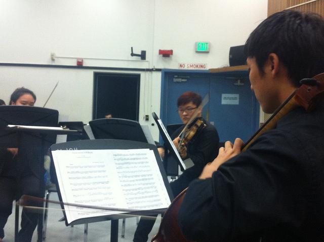 DVCs Philharmonic Orchestra features Jaewhi Kim on first violin, John Jungwoo Yoon on second violin and Dean Hiura on cello for their rendition of Mozarts Divertimento in D major.  This piece was one of three performed during the Music at Midday performance on March 6, 2014.