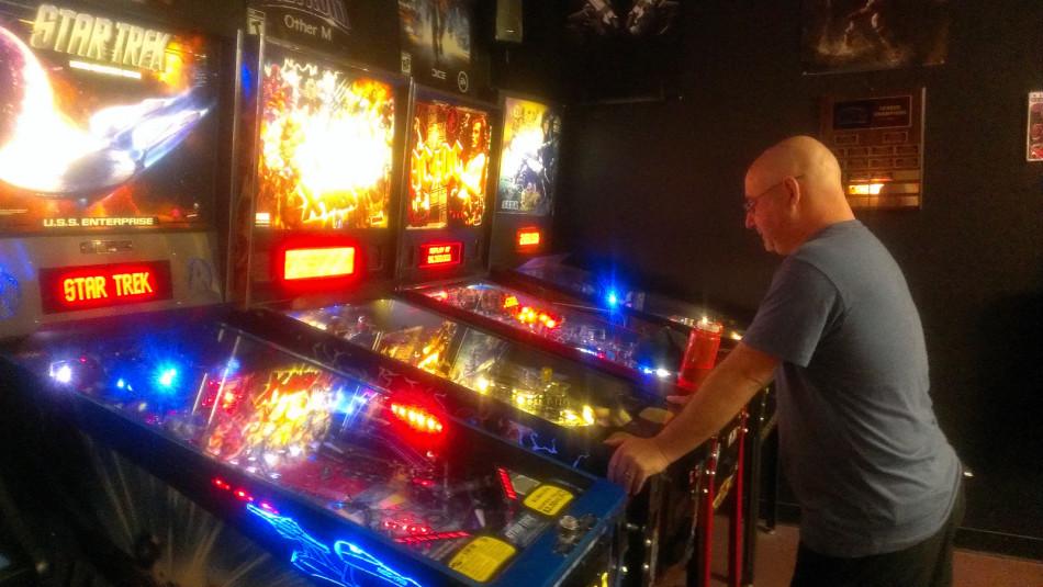 Mike Glick plays his third ball on the X-Men pinball machine at Phoenix Games in Concord. 

Glick is one of many people who frequent this store to play on the machines.
