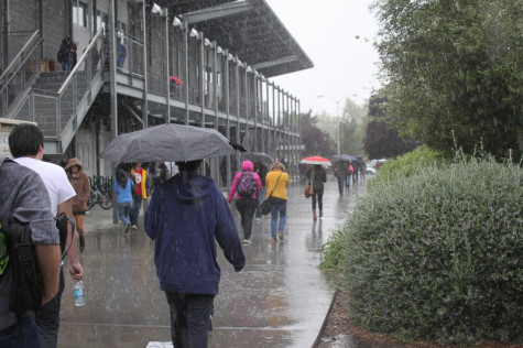 Rain drenched students rush to class during the brief 10 minute passing period.