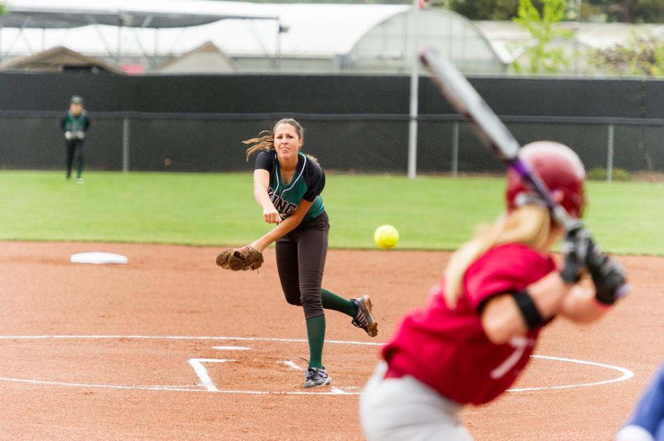 Pitcher Carrie Lee of Diablo Valley College starts the game off in the rain against Sacramento City College on Tuesday, March 25, 2014 in Pleasant Hill.
