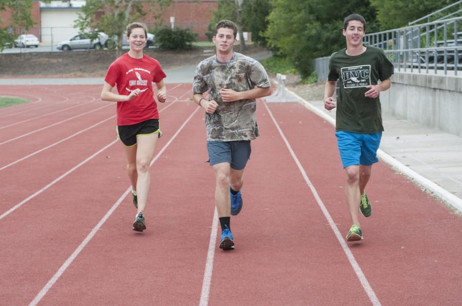 Diablo Valley College track and field team members Emma Shoenstein, Scott Lindsay and Joel Timbrell, run a cool down, after training on Thursday, May 8, 2014 at DVC track. 