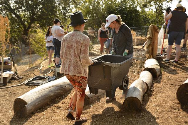 Students in Urban Farming class learn to prepare soil for  planting. 