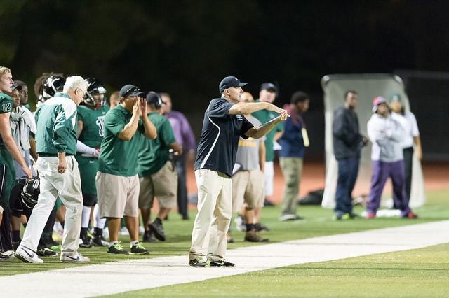 Head Coach Mike Darr is trying to explain a signal to his players in this game against Modesto City College on Sept. 19, 2014 in Pleasant Hill. Andrew Barber / The Inquirer