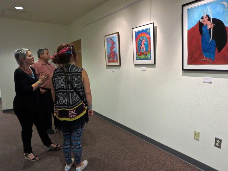 Catherine Jester explains the meaning of her artwork to viewers. September 2014.