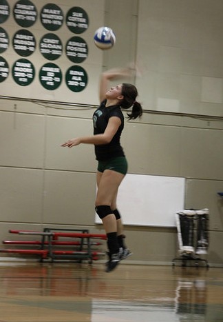 Right side hitter Amanda Jarquin serves the ball against Modesto Junior College on Wednesday, Oct. 1.