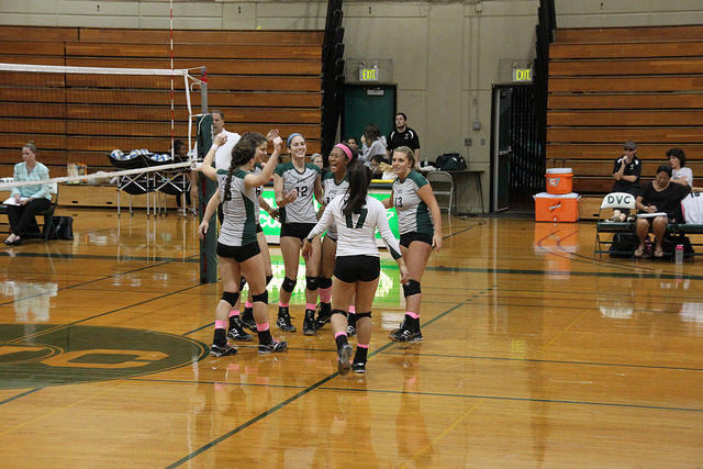 DVC Volleyball celebrates a win with a group hug on Oct. 29 at DVC. 