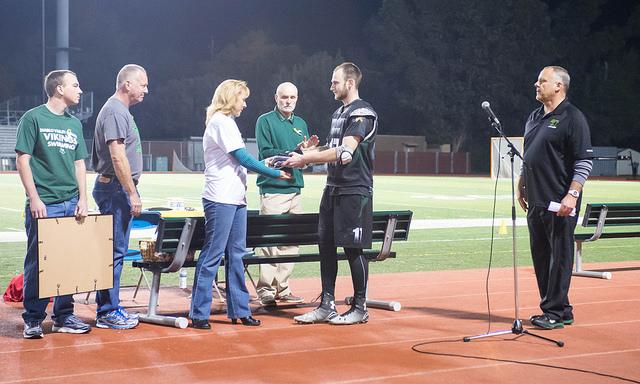 Captain Jared Malin presents McCulloughs retired jersey to her family on Saturday, Nov. 15 at DVC