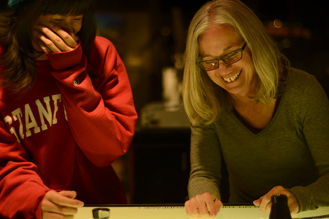 Alice Shaw and her Student Sarah Reblando, look at film negatives at the light table on Nov. 18.