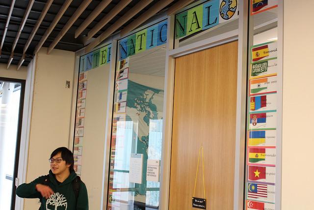 Hong Kong native Jeffrey Tiu stands outside the International Office, a familiar setting for most international students. 