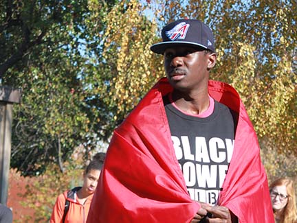Dieudonne Brou spoke at a vigil on campus in late November.