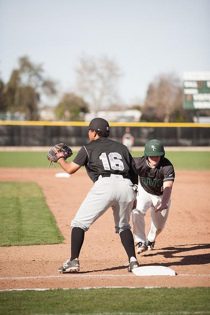 Hudson Bishop dives for first base as Andrew Mallon waits to catch the ball at DVCs game against Mission College on Feb. 12, 2015.