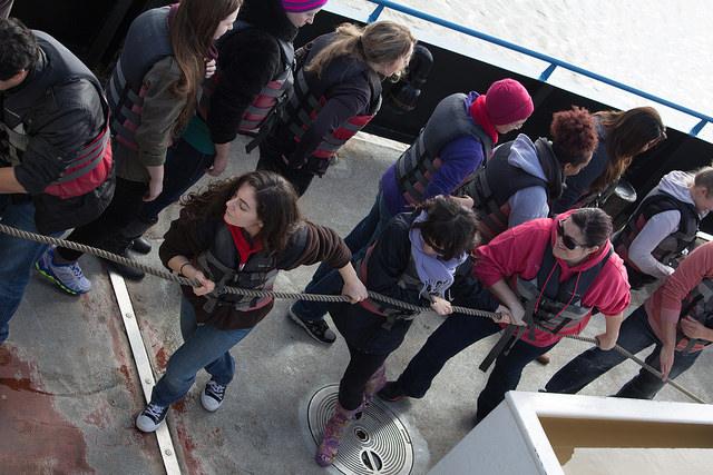 DVC oceanography students pulling the fishing nets out of the water in order to collect the specimens to identify on their February 21st, 2015 field trip out in Antioch. 