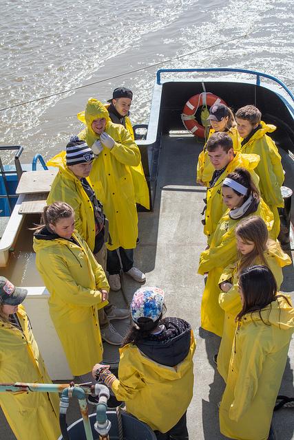 DVC oceanography students gather around to listen to Stephanie Weiner a science instructor giving instructions on how to correctly use the fishing nets during their field trip out in Antioch on February 21st, 2015. 
