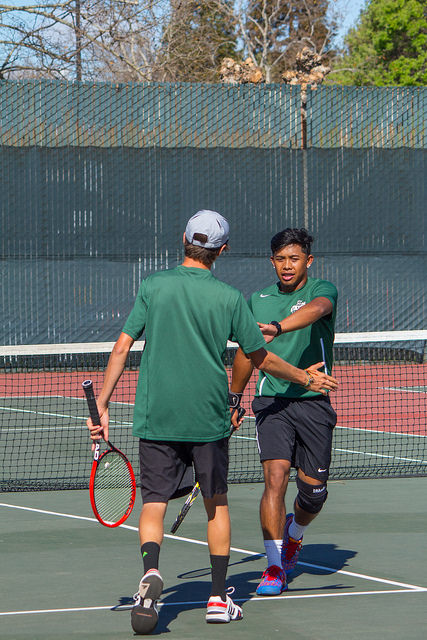 Sean Austin Miller 19 Business Major and His Partner Vaughn Asuncion Low Fiving During Their Match Against Folsom Lake on February 27th, 2015